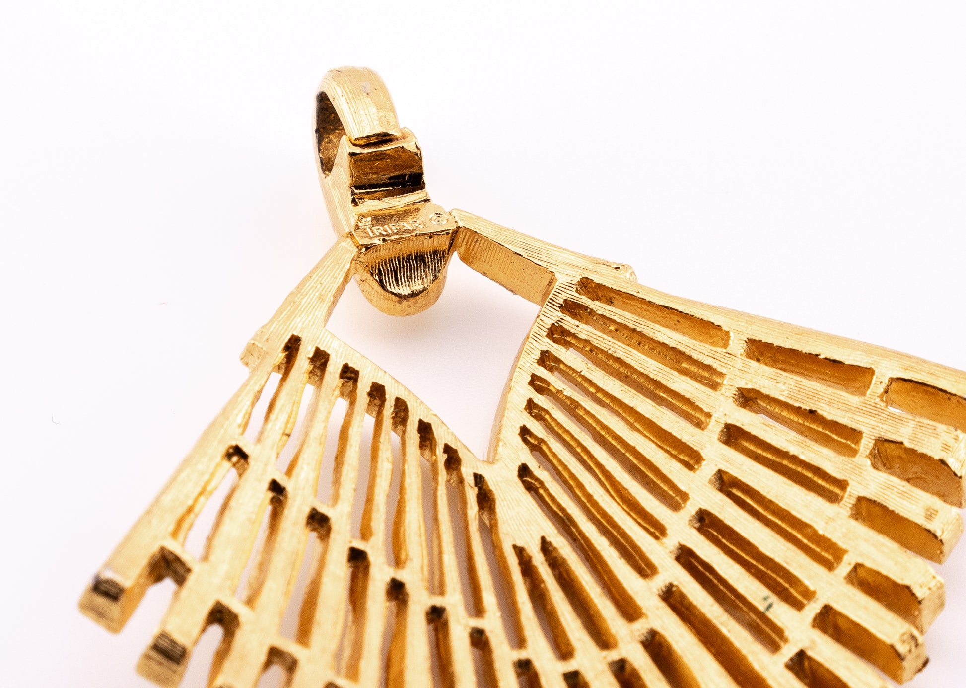 Crown Trifari hallmark stamped on the reverse of the pendant bail
