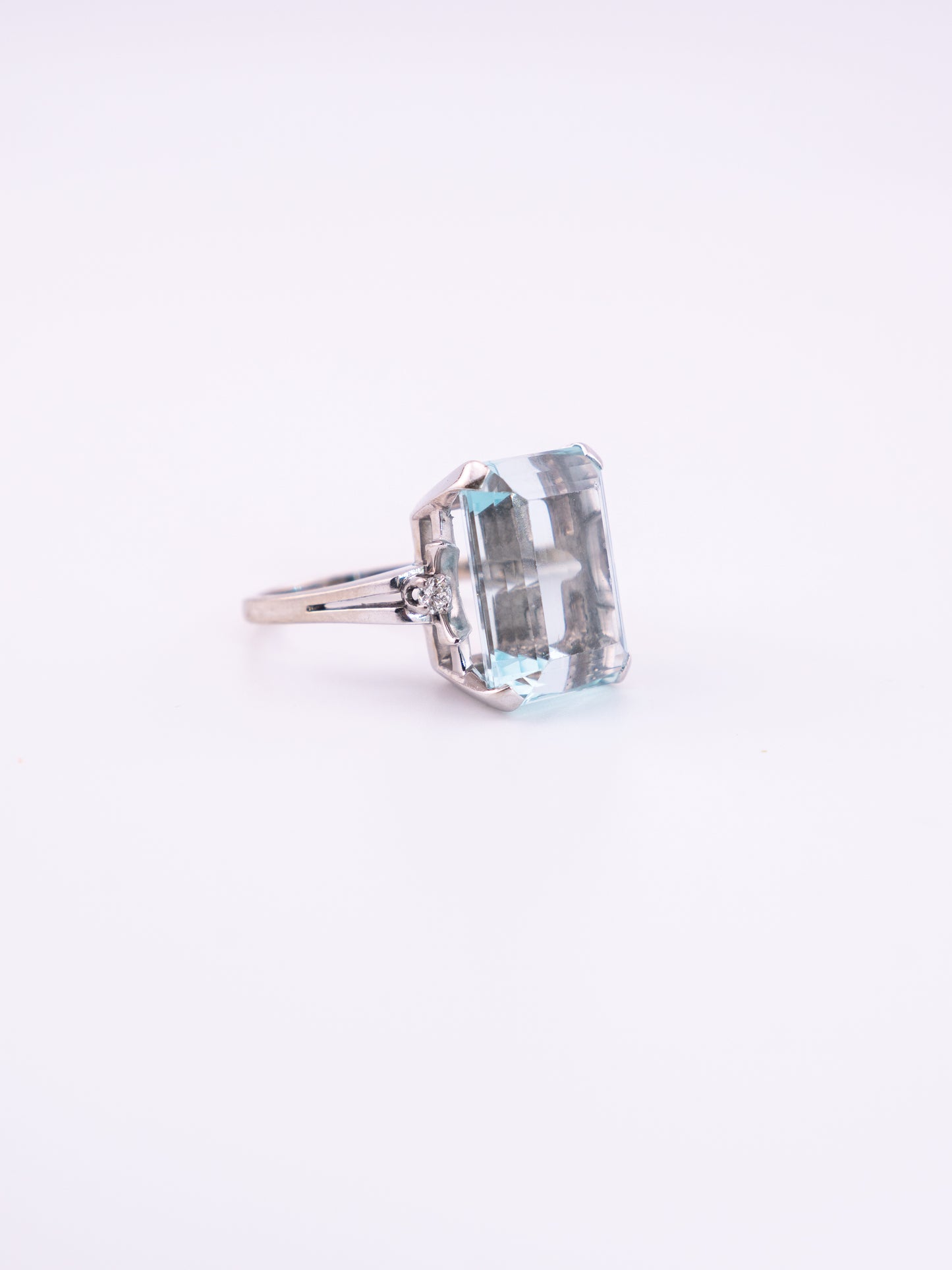 Ocean's Crown estate ring with 11.89 carat emerald cut aquamarine in 14K white gold