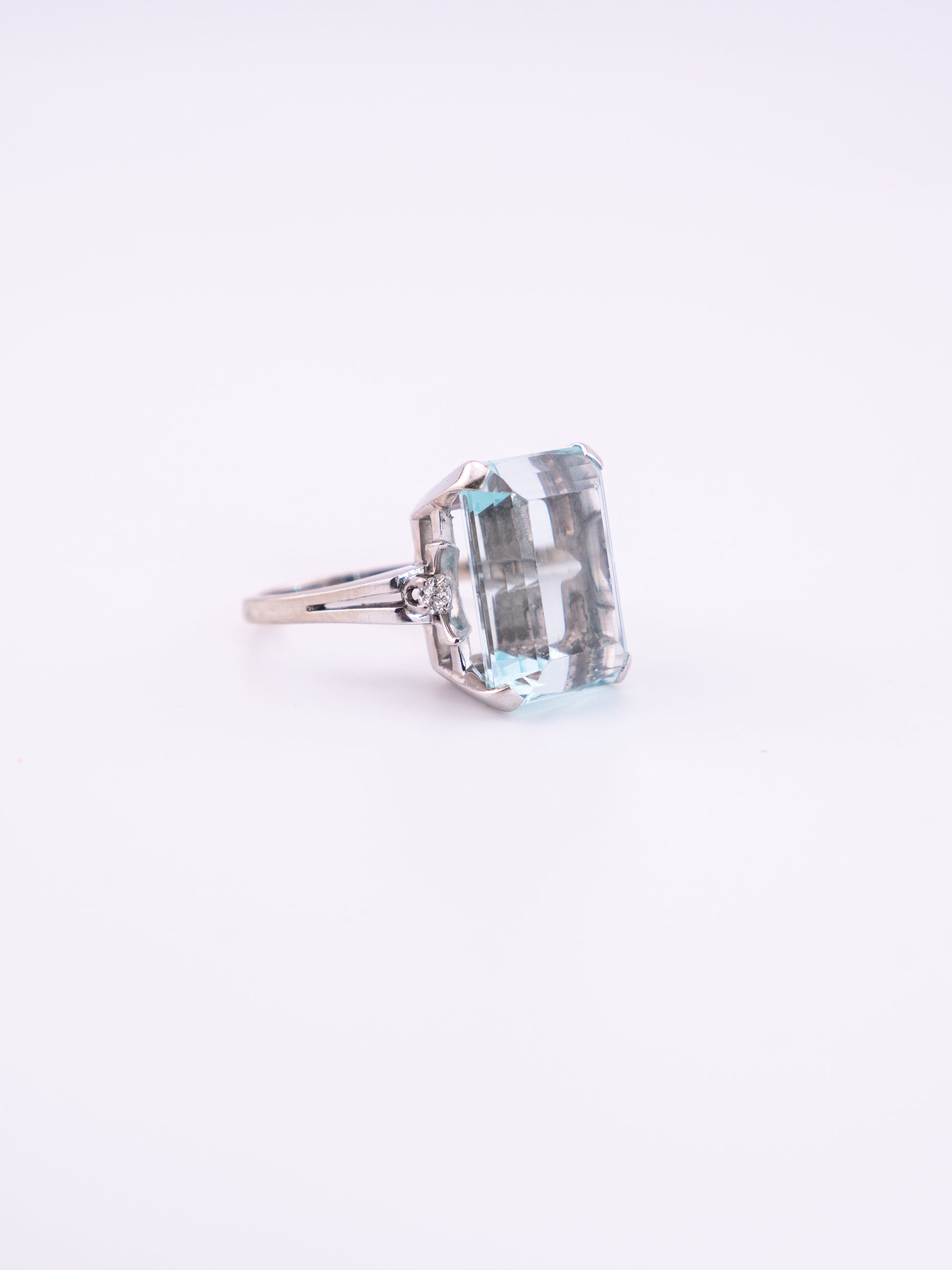 Ocean's Crown estate ring with 11.89 carat emerald cut aquamarine in 14K white gold