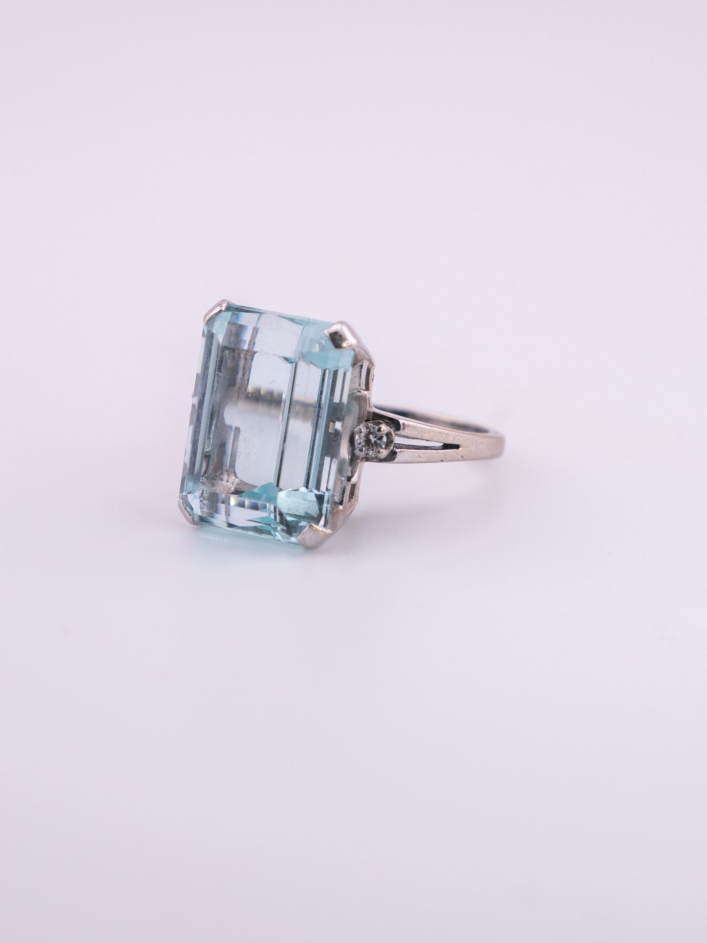 Ocean's Crown estate ring with 11.89 carat emerald cut aquamarine in 14K white gold