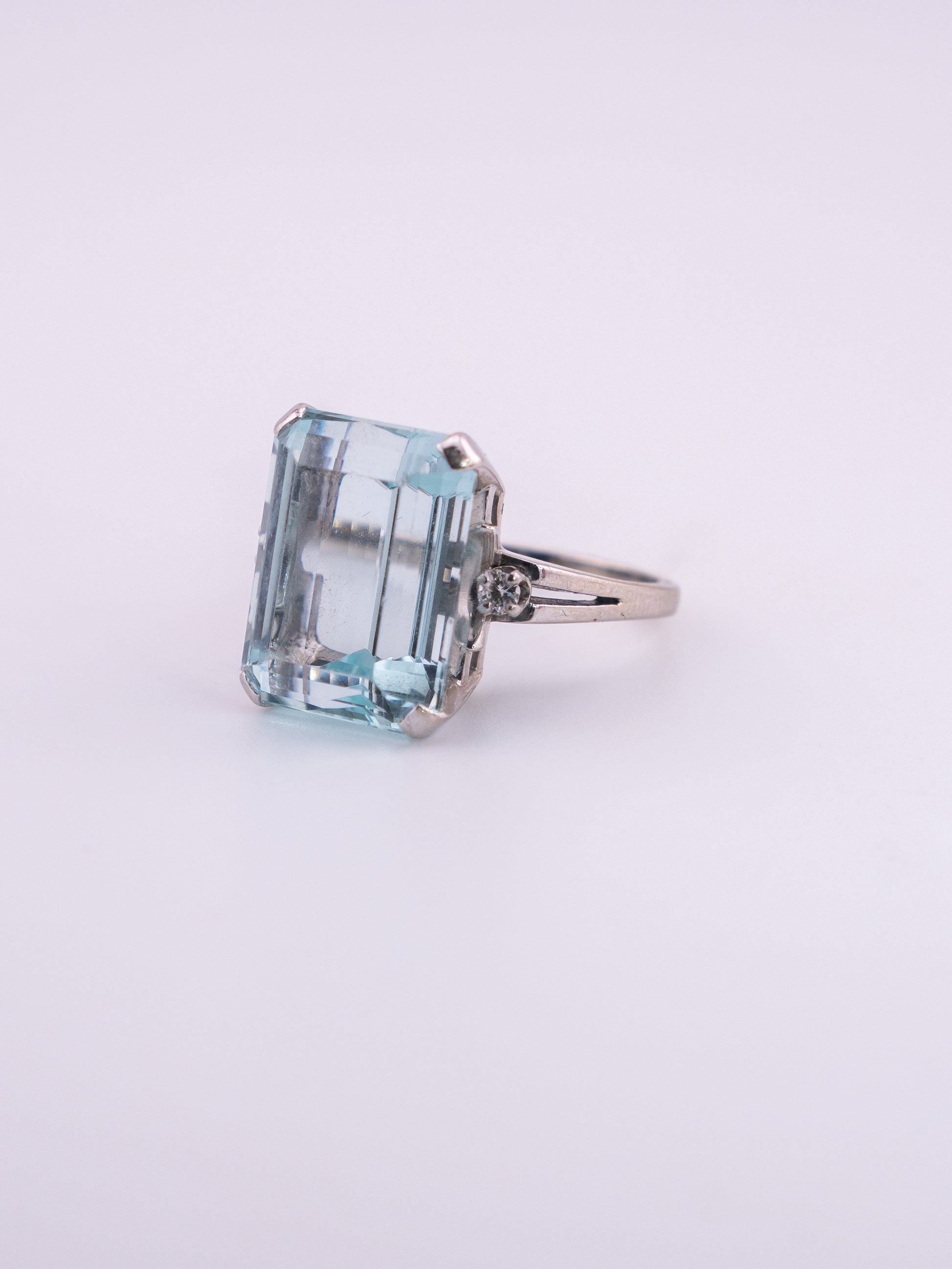Ocean's Crown estate ring with 11.89 carat emerald cut aquamarine in 14K white gold